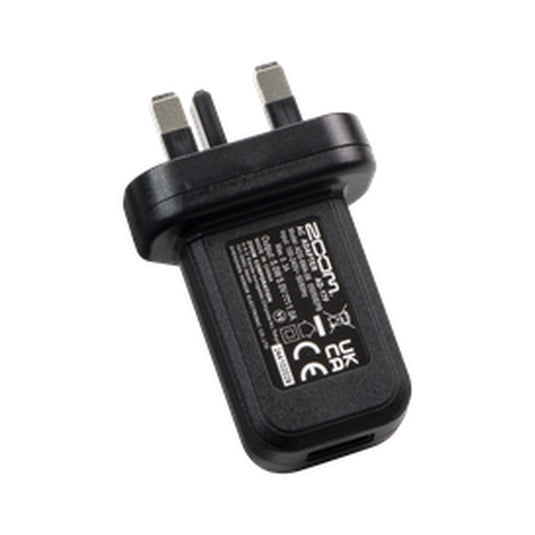 Black two-pin mains power supply adapter with EU-style plug pins and label