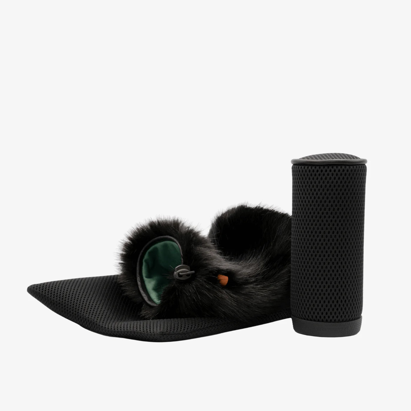 Black perforated spacer cylinder with black furry cover and green interior