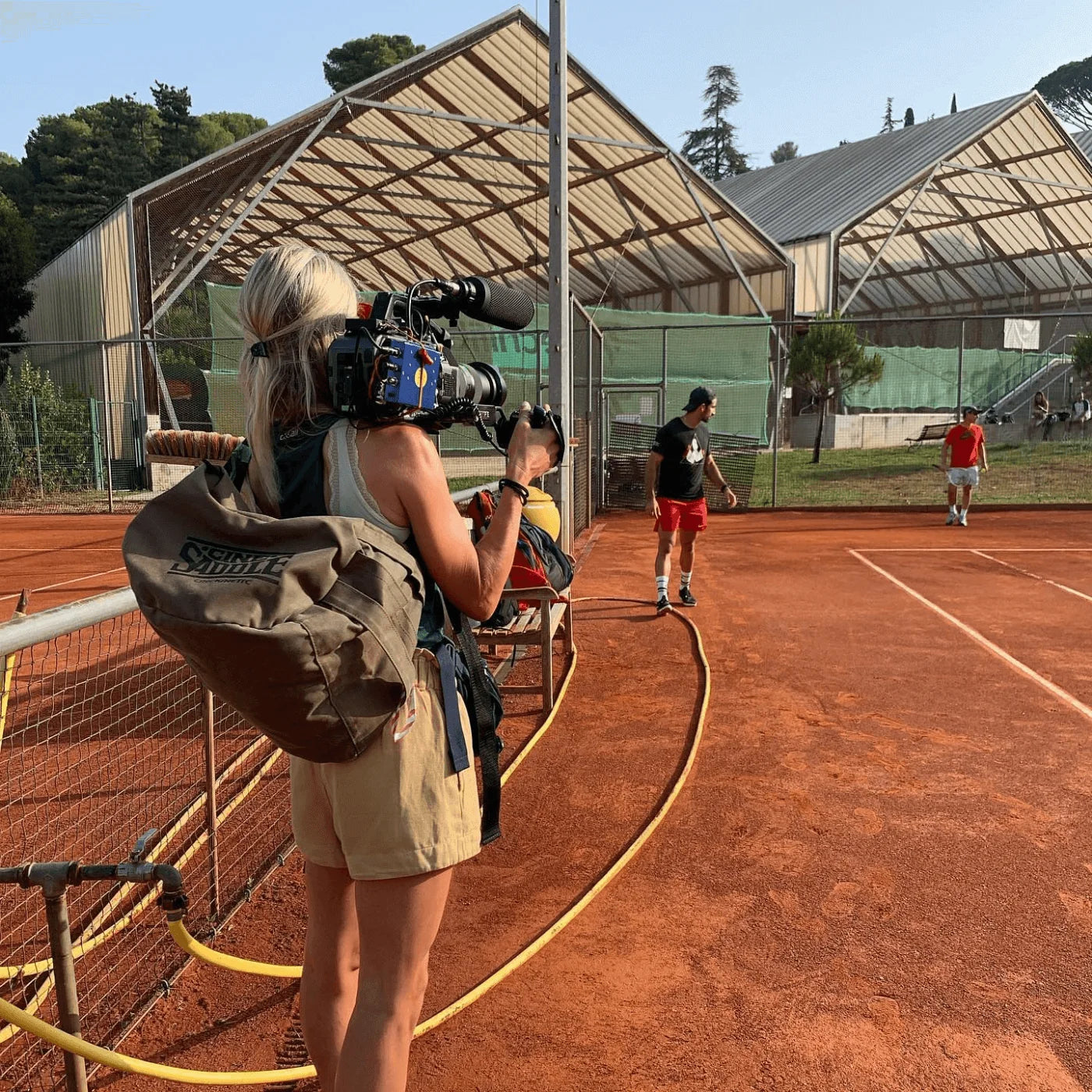 Blue foam microphone windscreen on outdoor filming camera rig