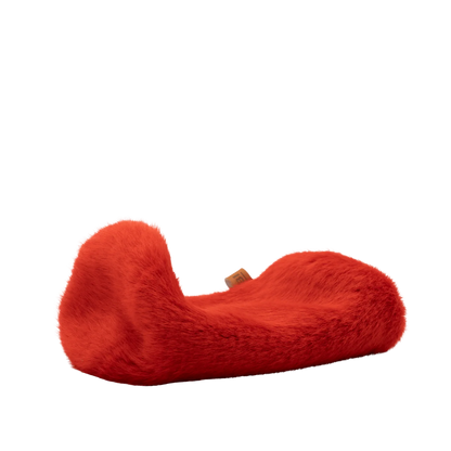 Red plush spacer cover with curved C shape and small fabric tag.