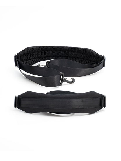 Black organizer case with wide shoulder strap and carry handle, closed with zippers.