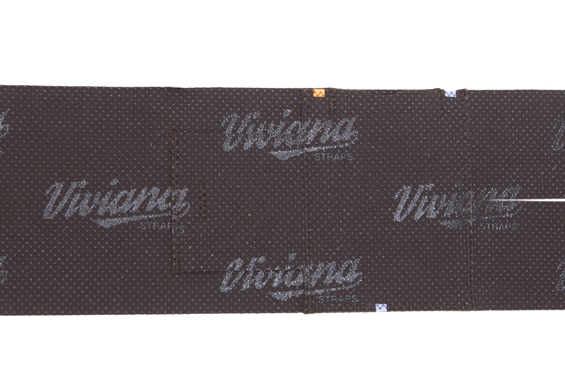 Dark brown calf strap close-up with grid texture and central seam panel.