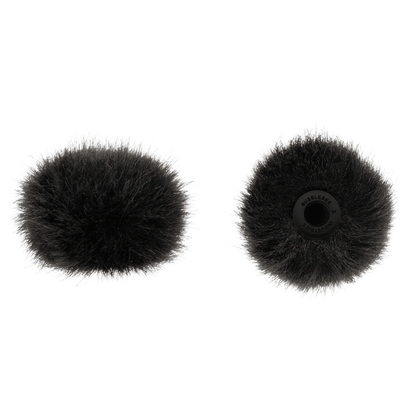 Two black circular microphone windscreens, front and back