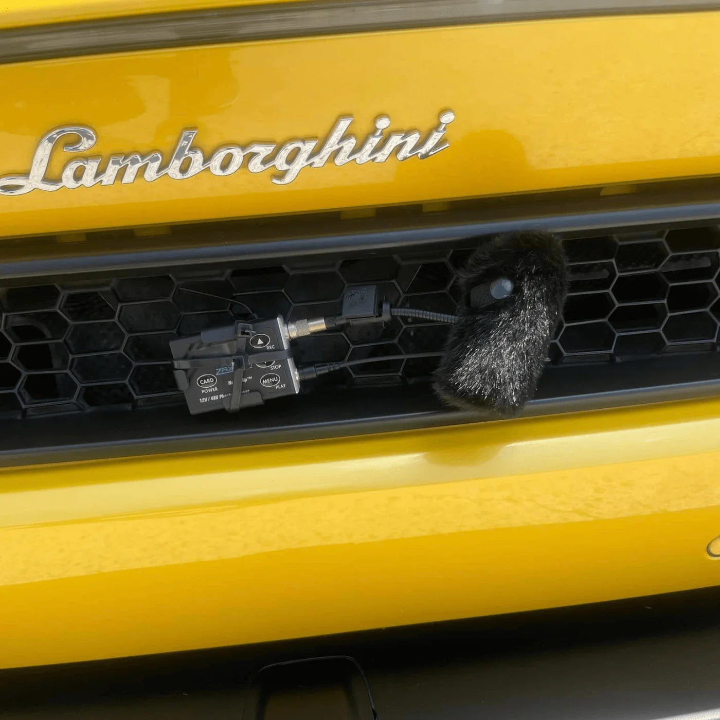 Black furry windscreen on a small microphone for DPA