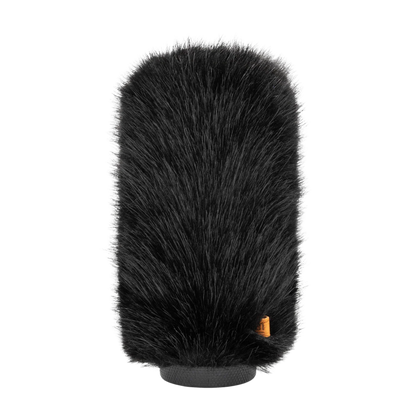 Hair brush attachment top view of dark bristles with gray base and orange label