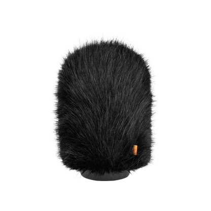 Hair brush attachment close-up of dark bristle top, gray base, small orange label
