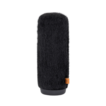 Black fuzzy microphone windscreen cover with orange label on base
