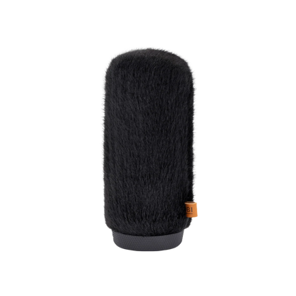 Hair brush attachment with dense dark bristles and gray base, orange label detail