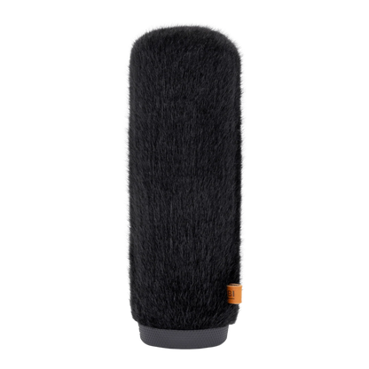 Hair brush attachment with dark long bristles and gray base, small orange label